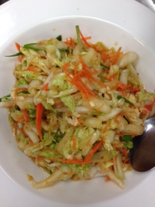 Quick Kim Chee Slaw -- Cabbage, grated carrots, and green scallions tossed with a ginger, garlic, sesame seed oil, rice wine vinegar, soy sauce, and crush red pepper flake marinade