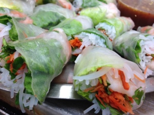 Shrimp Summer Rolls -- rice noodles, shrimp, mint leaves, basil leaves, grated carrots, and romaine lettuce wrapped in a rice paper wrapper