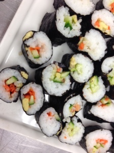 Vegetarian Sushi -- avocado, cucumber, carrots, sushi rice, and seaweed paper